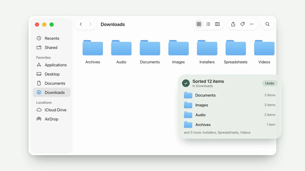 A Downloads window is right-clicked, Sort then All Files is chosen, and twelve files fly into Archives, Audio, Documents, Images and more.